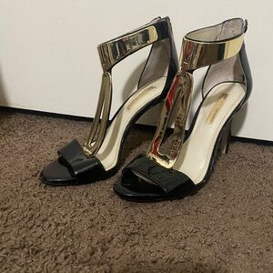 BCBGMaxAzria Black and Gold T-Strap Heels